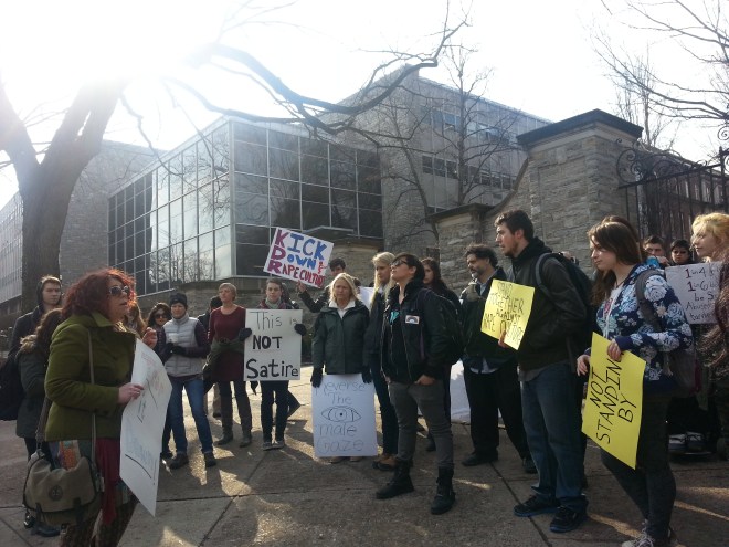 picture of more protesters and signage at the Window of Opportunity Speak Out and March