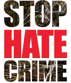 picture of a sign that says "Stop Hate Crime"