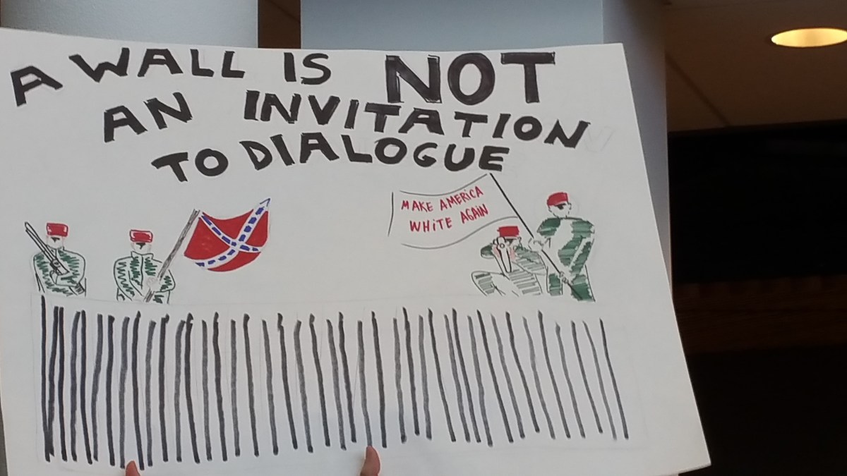 Picture of what looks like two federal officers holding a Confederate flag and two other officers carrying a flag that says "Make America White Now" standing behind a fence with guns. Above the cartoon are the words, "A wall is not an invitation to dialogue."