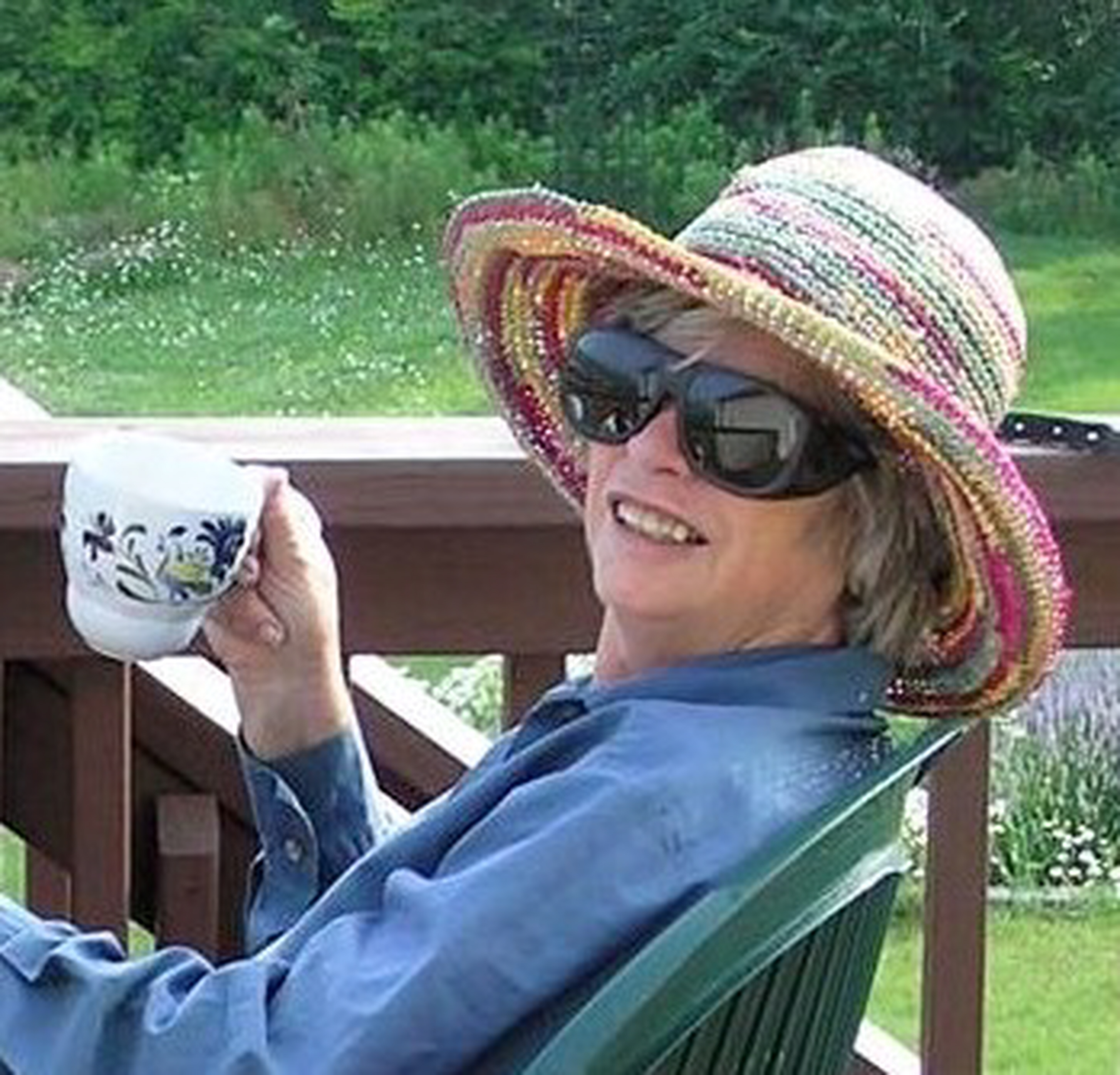 Picture of Colina Jordan Seeley sitting on her back porch.